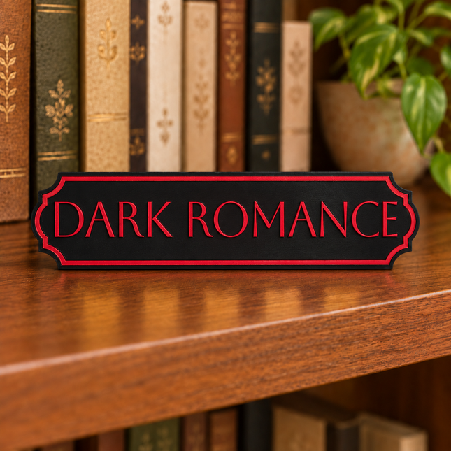 Dark Romance approved fixed lettering, shown on a freestanding genre sign as a lettering and color example.