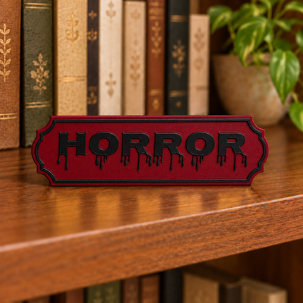 Horror approved fixed lettering, shown on a freestanding genre sign as a lettering and color example.