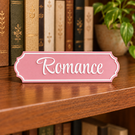 Romance approved fixed lettering, shown on a freestanding genre sign as a lettering and color example.