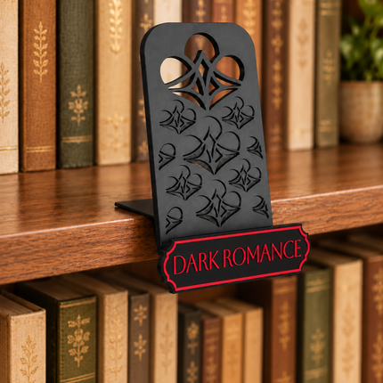 Dark Romance genre sign attached below the black book display shelf at the bookshelf edge. Example colors shown.