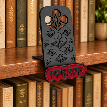 Horror genre sign attached below the black book display shelf at the bookshelf edge. Example colors shown.