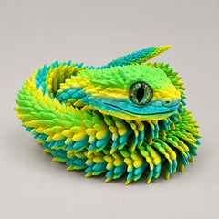 Articulated bush viper with glass eyes photographed on a warm gray studio background