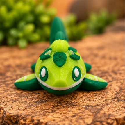 Front view of Micro Lime Shark miniature on a warm stone display with greenery.