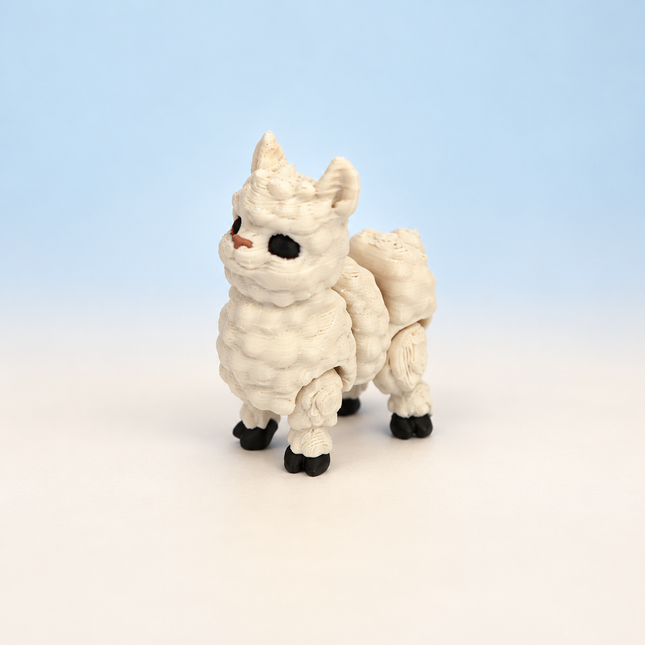 Micro Llama 3D-printed miniature featuring a cream-colored textured body, long neck, and dark hooves, on a light surface with a pale blue background.