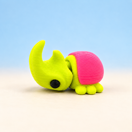 Micro Rhinoceros Beetle miniature in Yellow and Pink, individual variant photo.